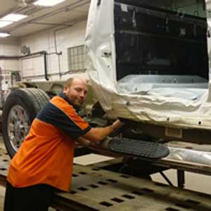 Man repairing car frame